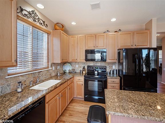 Gourmet Kitchen with granite counter tops and tile backsplash