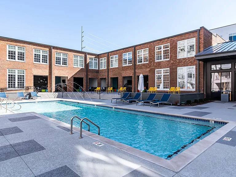 Resort-style Swimming pool with Tanning Ledge and Expansive Sundeck