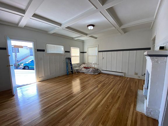 Entry to coffered ceiling in living room. Has non-functioning fireplace.