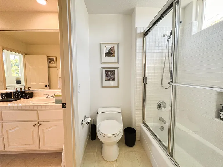 Bathroom 3 (direct access from Bedroom 3 and shared access in hallway). Separate water closet.