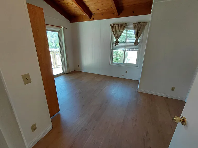 Large bedroom with direct access to the private deck.