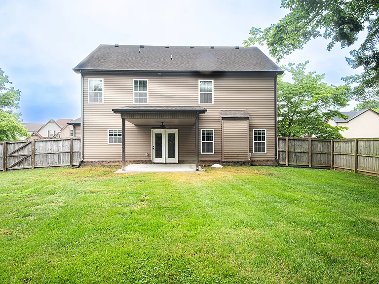 Covered back porch and a fully fenced-in, private backyard