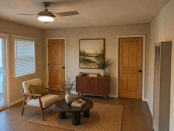 living room facing the bathroom (left) and bedroom (right)