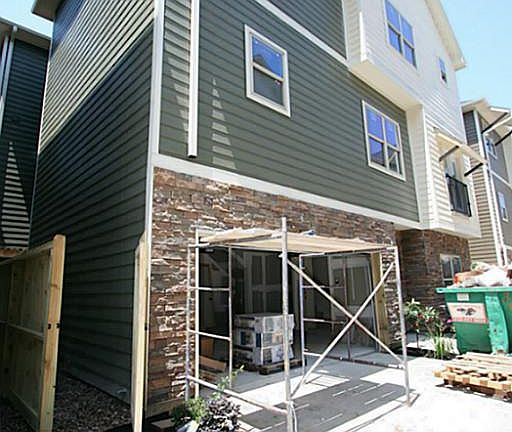 Exterior of Unit E. Homes have solar conduit, insulated doors, radiant barrier and more energy featu
