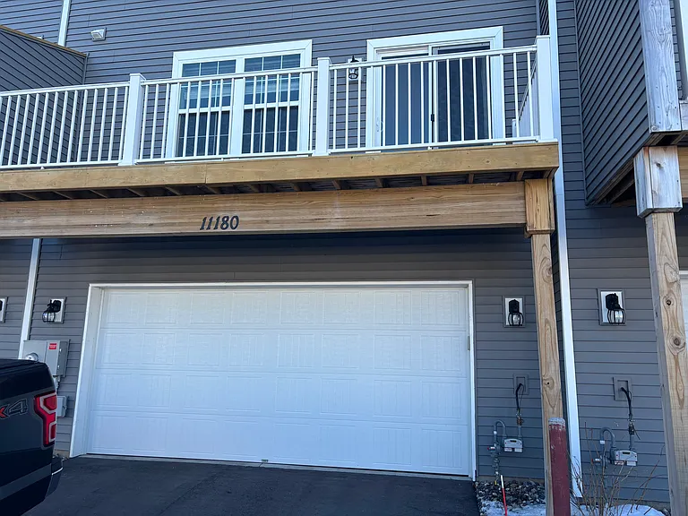 Insulated two car garage and deck looking over the park.