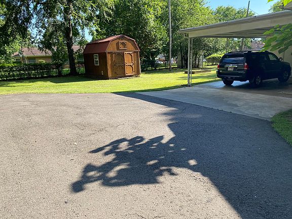 Private driveway and covered carport