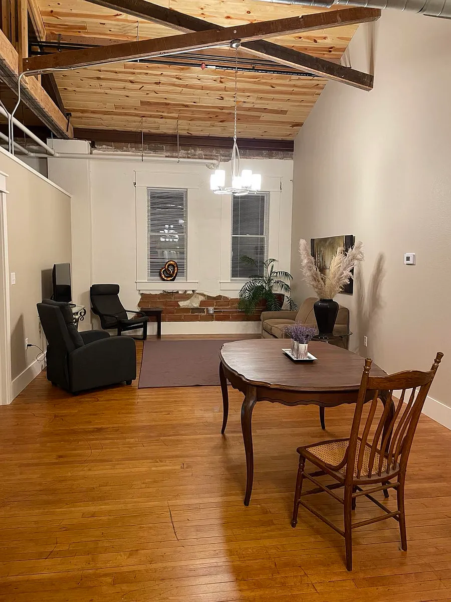Open dining room and living room. Plenty of space for a large table as well as a full set of living room furniture. - 211 E Water St #2