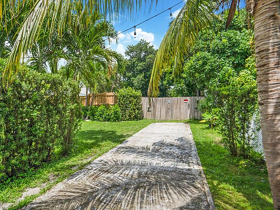 Private paved driveway can accommodate 2 cars, but many more inside and outside the property