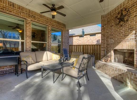 Outdoor entertaining area with a fireplace.