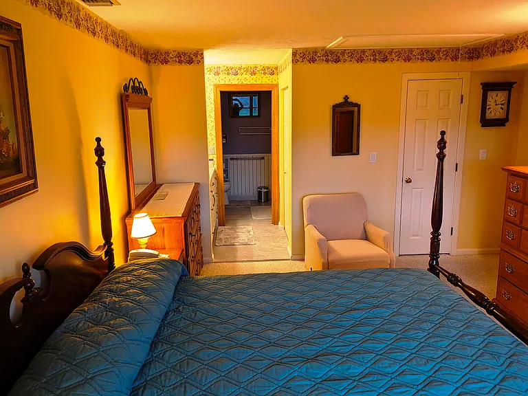 master bedroom view to ensuite vanity area and bathroom area beyond