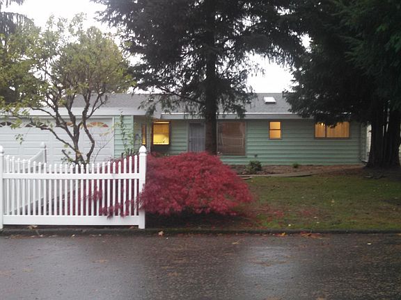Level driveway is 3 cars wide to this home on quiet dead end street