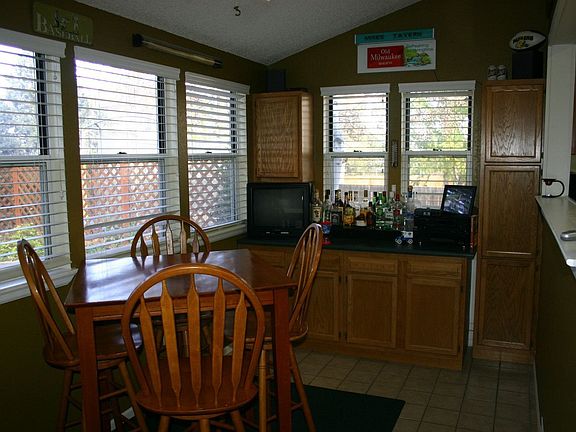 Sun Room with Tile Floors and Skylights