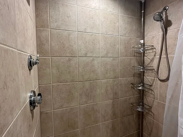 Upper/loft level full size walk in shower with double shower heads