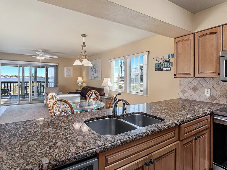 Enjoy the waterfront view while cooking from the well-equipped kitchen.