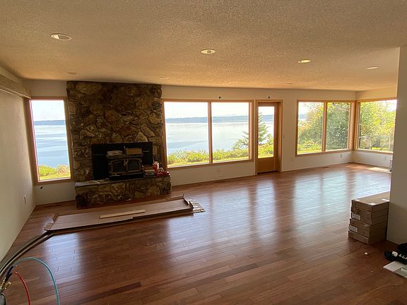 Finishing up the flooring with new Brazilian cherry floors, custom thermapane windows and new lights.