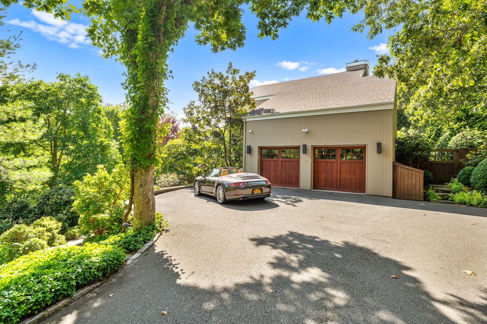  2 Car Garage and Lush Landscaping