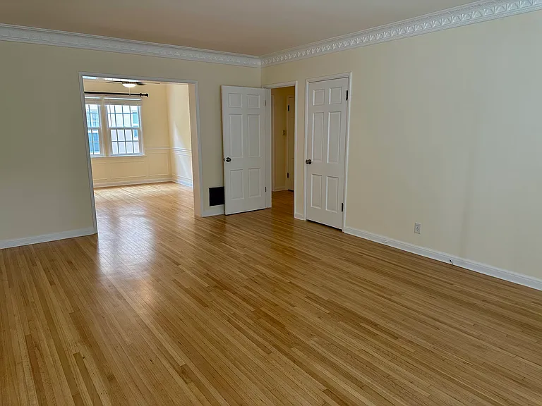 Living area looking onto dining area / office space
