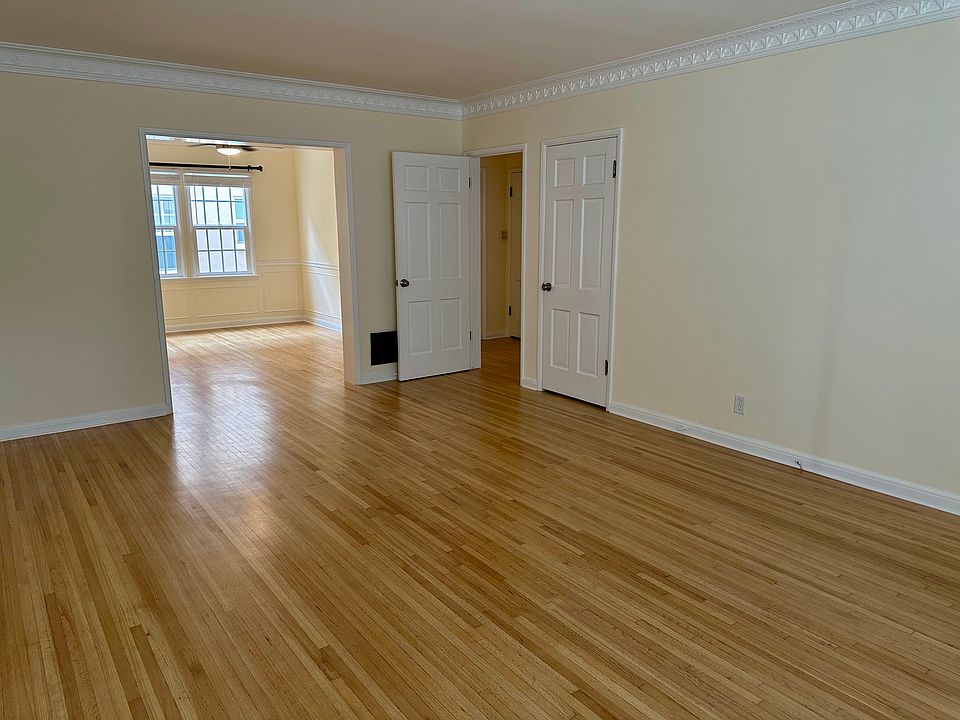 Living area looking onto dining area / office space