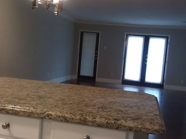 Kitchen overlooking dining and living rooms.