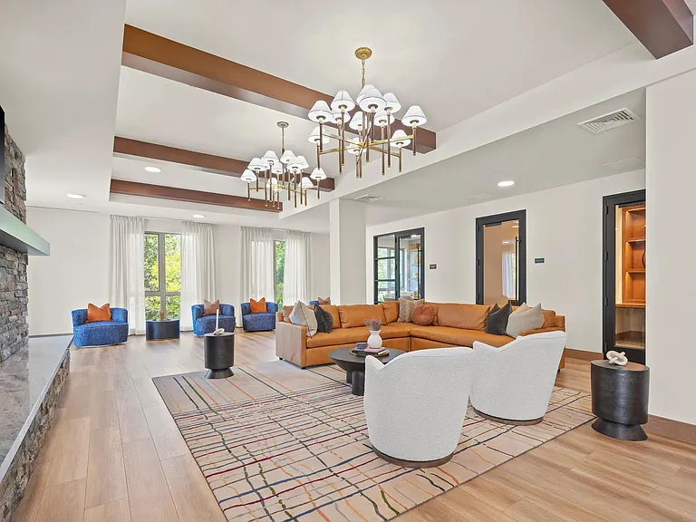 Lounge with fireplace and comfortable seating.