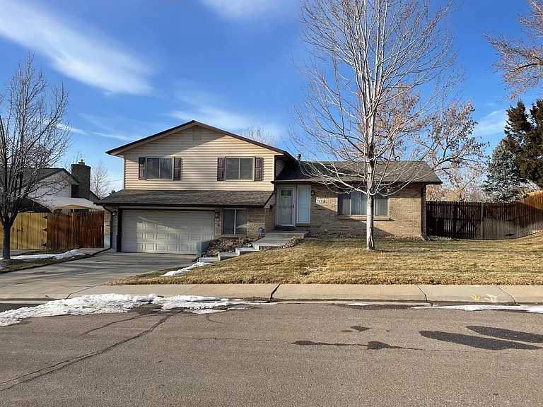 Front view, split level home with attached 2 car garage