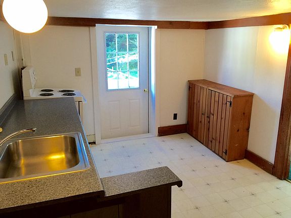 There is an office den or bedroom off the kitchen to the right.