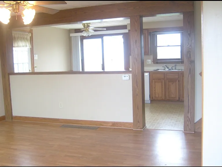 Living room and entryway closet.