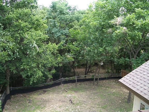 View from Upper covered balcony. Property line extends to middle of the creek.