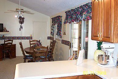 Den or dinning area. Floor is now tile and wallpaper removed and painted