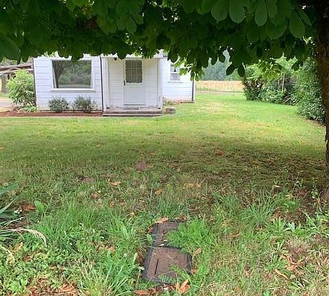 Front of house with view of right side yard