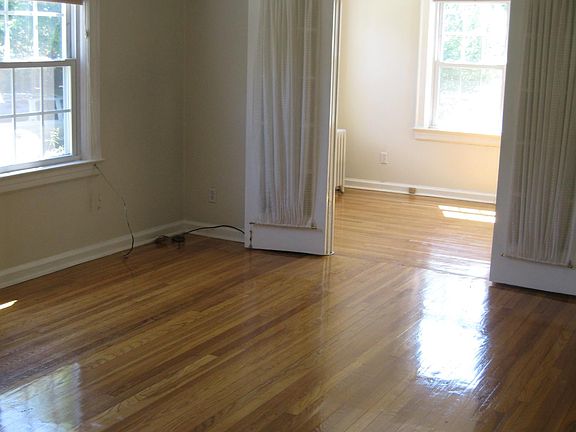 Living Room to Sunroom View, ceiling fans, bright and open