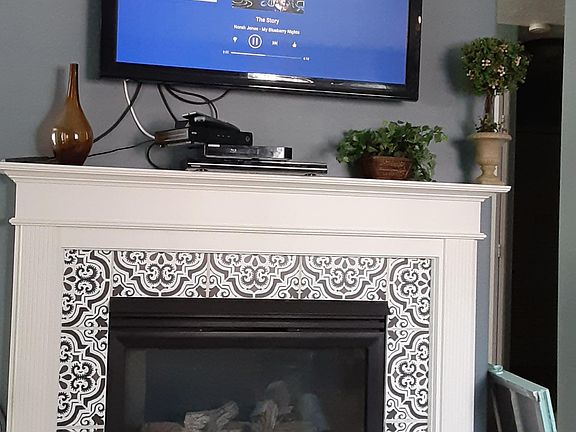 Living room fireplace and TV with DVD, Cable and Firestick with Netflix, etc