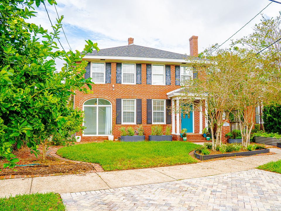 Exterior of 1215 Landon featuring mature crepe myrtles, a lime tree and lemon tree