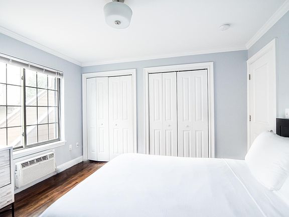Spacious Master Bedroom with hardwood floors, crown + base molding, two spacious closets, powerful A/C & Heating! The room gets a lot of light and has a beautiful view of the condo complex!