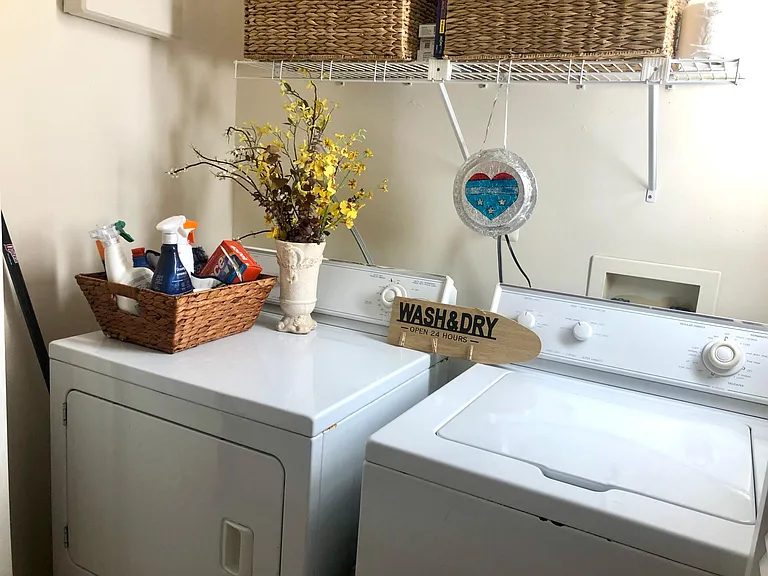 Washer/Dryer inside closet doors. Located in hall outside master BR
