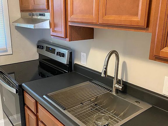 Kitchen with new appliances and deep sink with pull down faucet