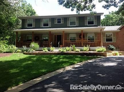 Brick/Cedar with covered front porch
						:
						Hillside with 3 car garage and new driveway with concrete apron