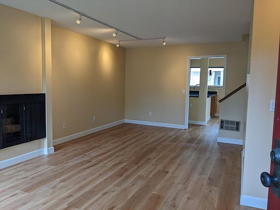 Spacious, living room with working fireplace
