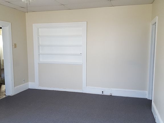 Family room with large closet and shared entrance.