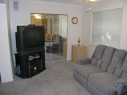 cozy den has more storage, TV, double recliner and Murphy bed 