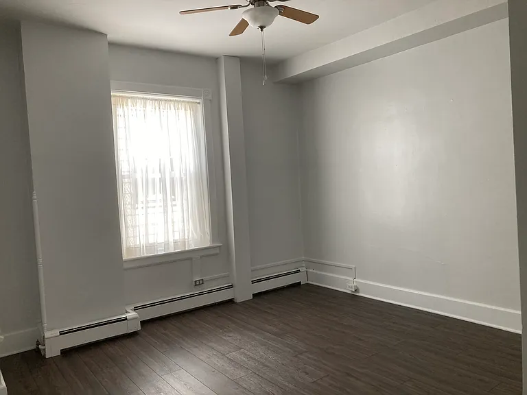 Master bedroom, ceiling fan, two closets. 2nd closet is a walk-in with lighting, multiple shelves and full-length mirror attached to closet door.