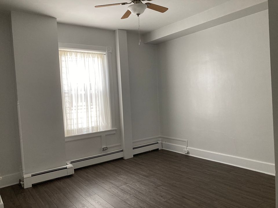 Master bedroom, ceiling fan, two closets. 2nd closet is a walk-in with lighting, multiple shelves and full-length mirror attached to closet door.
