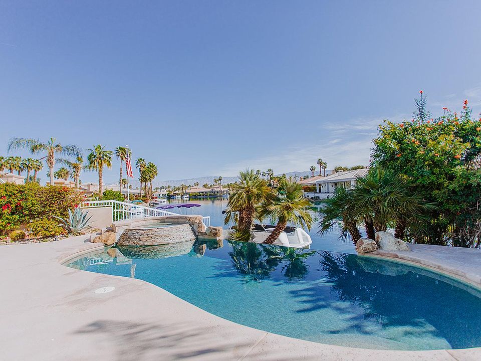 Take in the lakeside & desert views from this sparkling infinity edge pool!