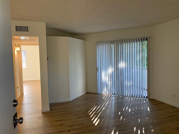 bright and sunny living room welcomes you in