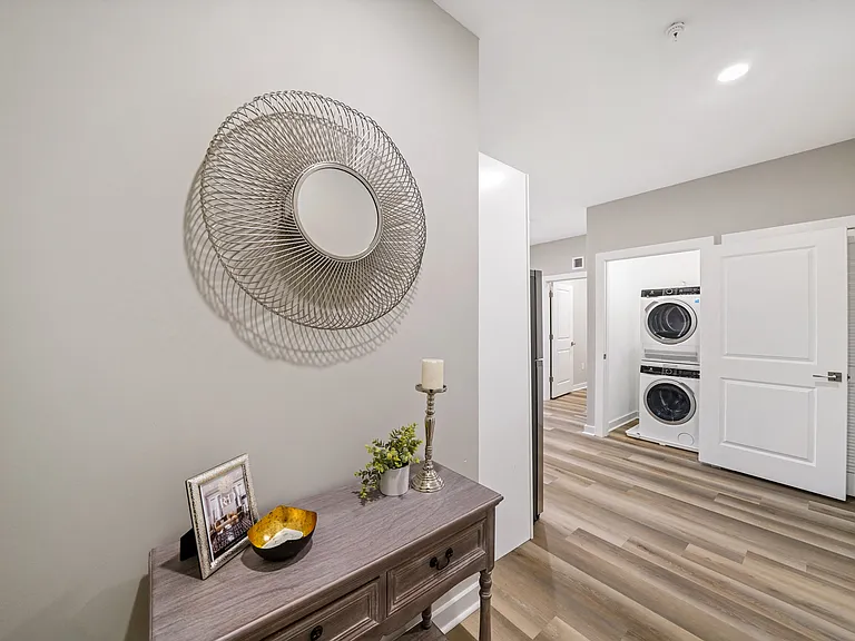 Entryway with view of in-unit washer and dryer