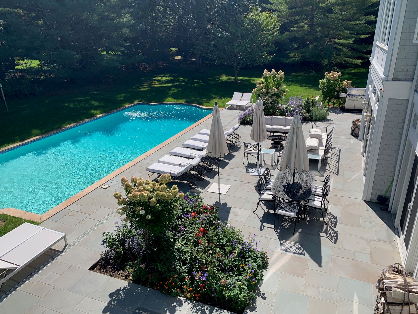  2,000 square foot bluestone pool patio .