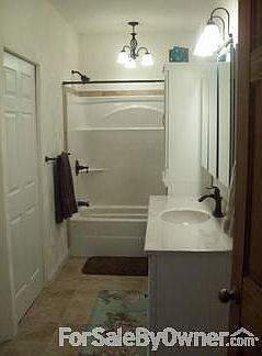 View of bathroom from dining room