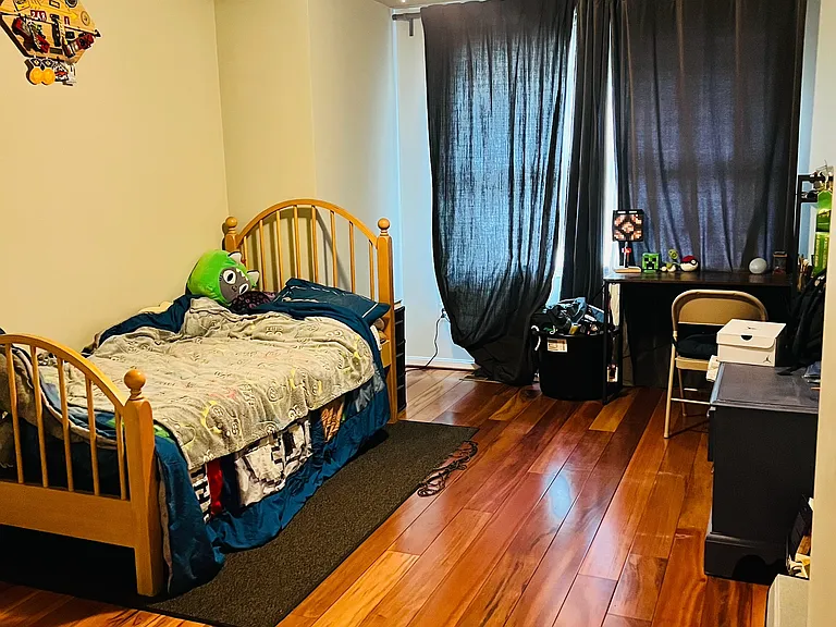 Third bedroom on top floor with large windows