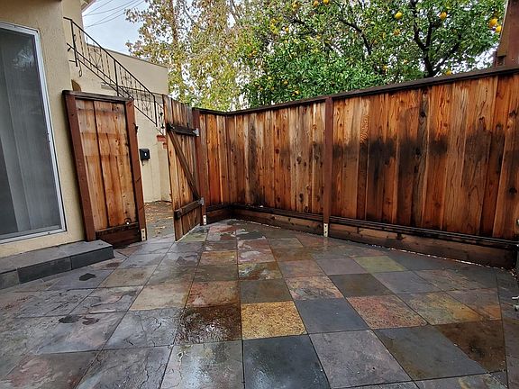 Patio off Living Room. Has water bib, patio light and electrical outlet for even more lighting. Newer fencing