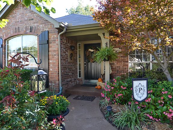 Covered Entry and Nice Landscaping